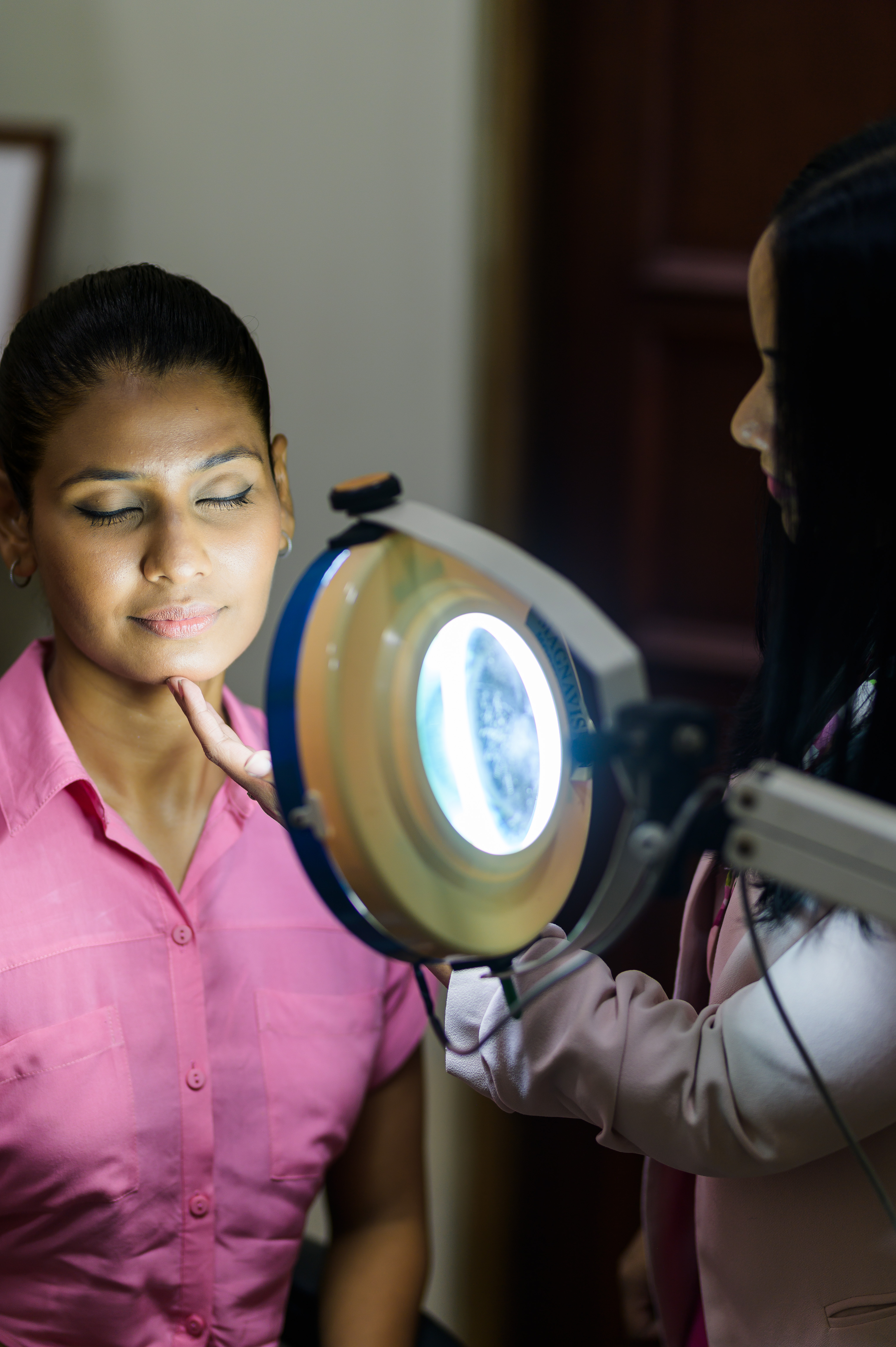 Dermatologist using diagnostic light
